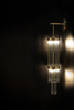 Elegant Vertical Crystal Wall Light with Golden Accents And Marble Mount
