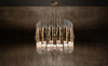 Luxurious Gold And Clear Glass Pendant Light with Modern Layered Design, Perfect for Enhancing Style in Dining Rooms And Contemporary Spaces