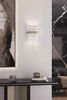 Refined Clear Crystal Wall Sconce with Gold Band Accent, Perfect for Illuminating Contemporary And Elegant Settings