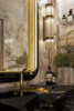 Modern Gold Wall Sconce with Tiered Crystal Rods, Perfect for Sleek And Elegant Lighting Solutions