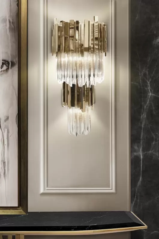 Opulent Gold And Clear Crystal Wall Lamp with Luxurious Tiered Design, Ideal for Sophisticated Ambient Lighting in Elegant Spaces